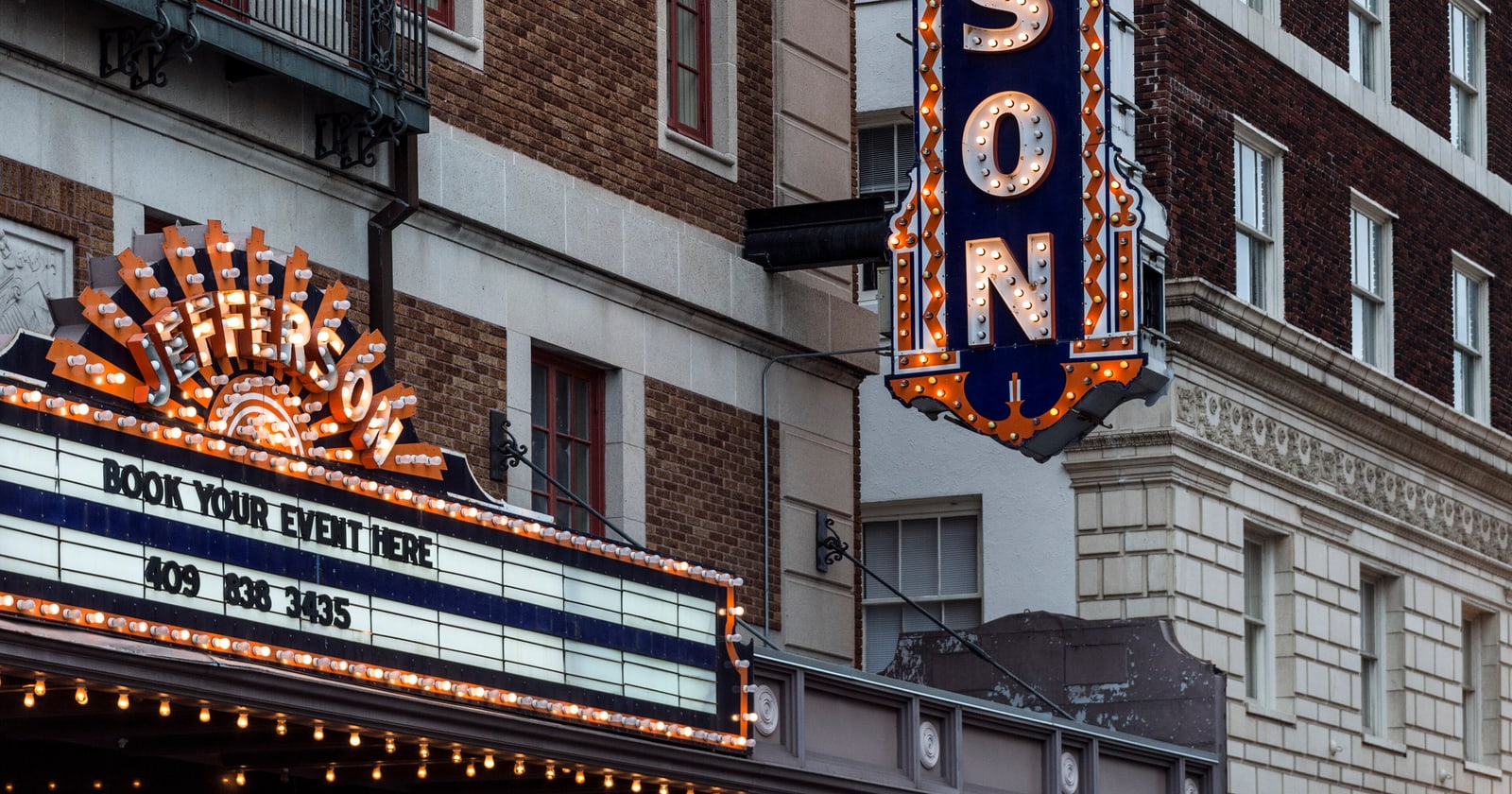 The Jefferson Theatre's lit marquee in downtown Beaumont at dusk, a restored 1927 movie palace and one of the things to do in Southeast Texas this weekend