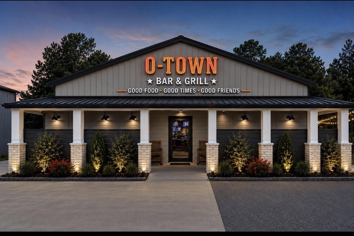 O-Town Bar and Grill front porch and sign at dusk, from the bar's Facebook page