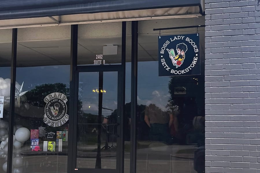 The Boss Lady Books storefront at 2462 Calder Ave, Suite B, Beaumont, with a hanging SETX Bookstore sign and a grand opening decal in the window