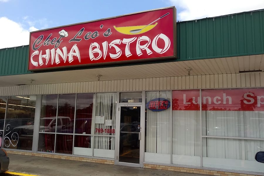 The Chef Leo's China Bistro storefront in a Vidor strip center, its red sign over glass doors with 769-1888 painted on the window